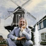 James Last (Date Unknown) on location.

[keywords]Posed, Half Length, Eyecontact, Smiling, Fountain, Windmill[/keywords]